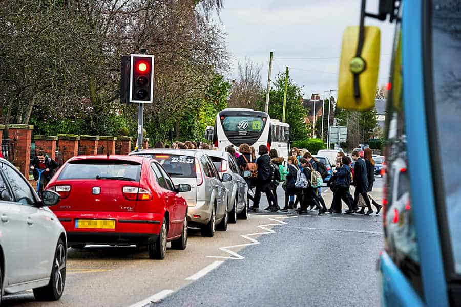 school children crossing a road