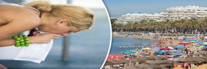 a woman suffering with sickness on holiday | holiday compensation claims
