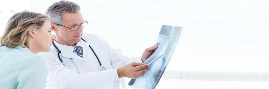 2 doctors looking at an xray