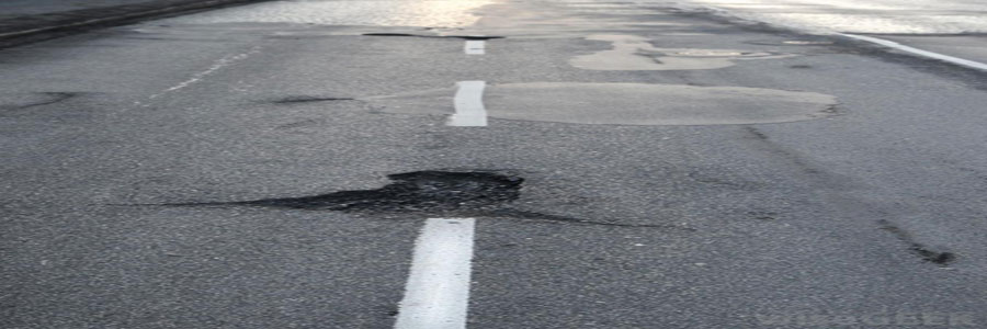 a pothole in the middle of a road