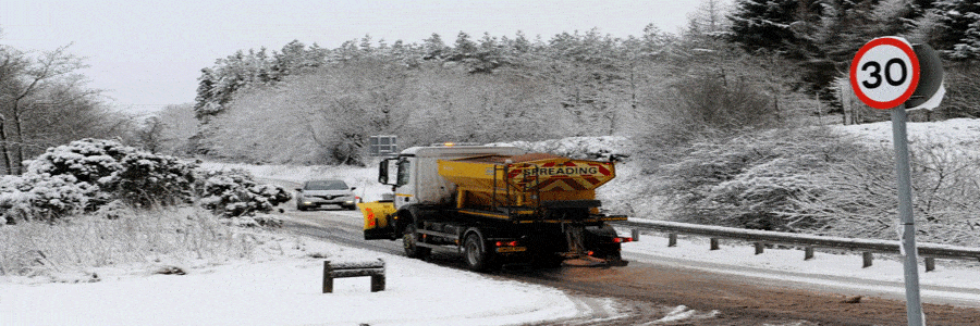 a snowplough going through the countryside